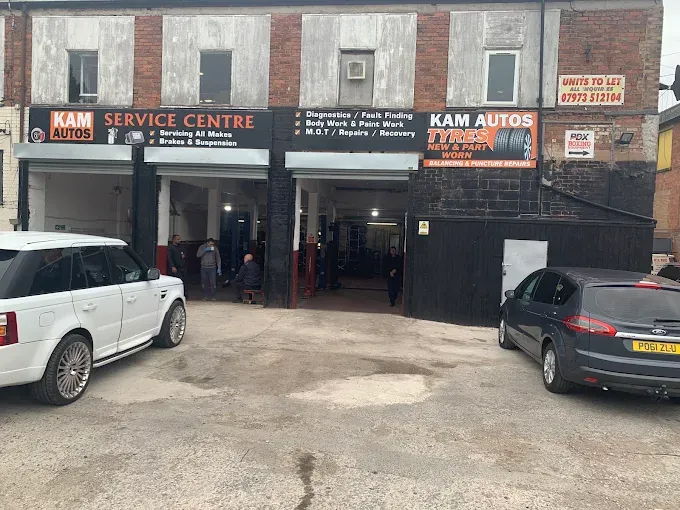 Kam Autos Service Centre exterior in Derby with workshop bays open